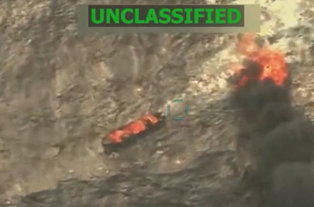This screen grab from a video posted by US President Donald Trump on his Truth Social account on September 15, 2025, shows what President Trump says is US Military forces conducting a strike on a boat carrying alleged drug traffickers in the Caribbean Sea in the SOUTHCOM area of responsibility